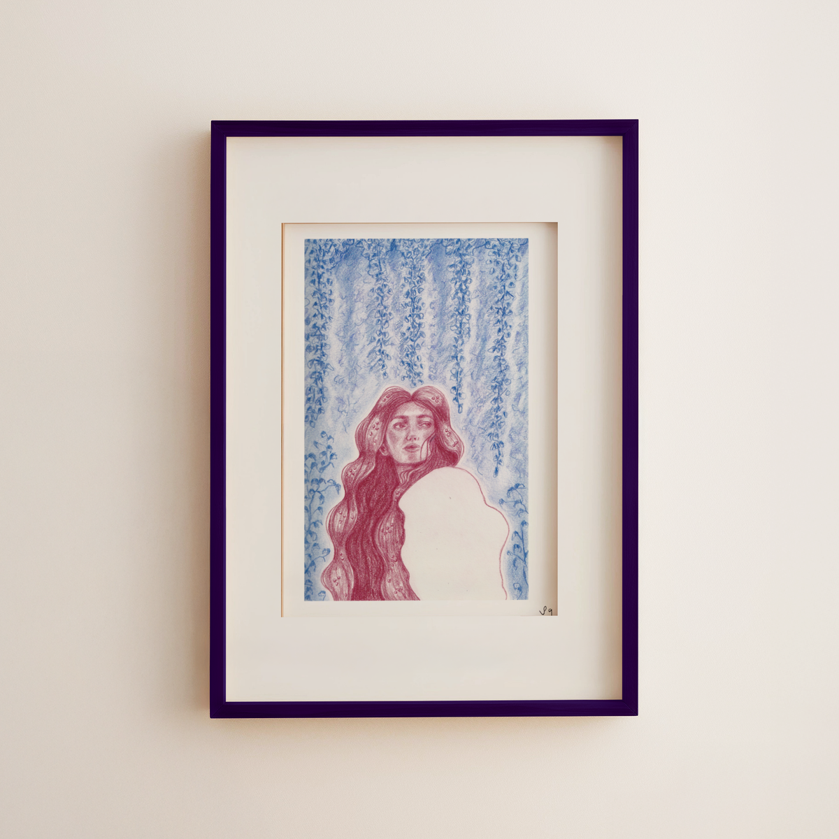 A framed art print featuring a stylized illustration of a woman with long red hair against a blue hanging floral background, set in a white mat and a dark purple frame on a light beige wall.